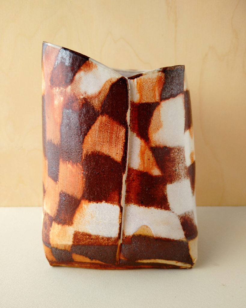 A large, stout, square-shaped vase with a nerikomi pattern of contrasting checkers.