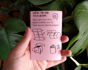 On the back of a folded booklet is a diagram which illustrates how to turn the book inside out.
