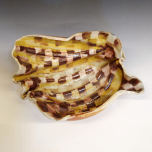 Banana Bowl 02 is a soda-fired ceramic fruit bowl with a sunshine yellow glaze over a warm brown nerikomi checker pattern.