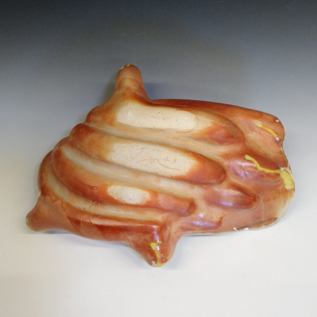 Banana Bowl 05 is a soda-fired ceramic fruit bowl with a sunshine yellow glaze over a warm brown nerikomi checker pattern.