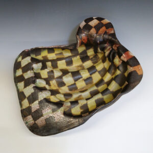 Banana Bowl 07 is a soda-fired ceramic fruit bowl with a sunshine yellow glaze over a warm brown nerikomi checker pattern.