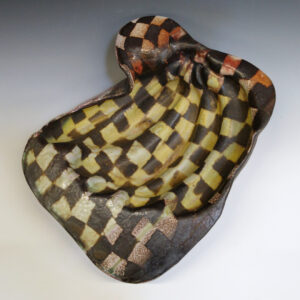 Banana Bowl 07 is a soda-fired ceramic fruit bowl with a sunshine yellow glaze over a warm brown nerikomi checker pattern.