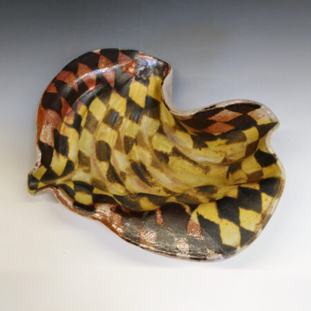 Banana Bowl 08 is a soda-fired ceramic fruit bowl with a sunshine yellow glaze over a warm brown nerikomi checker pattern.