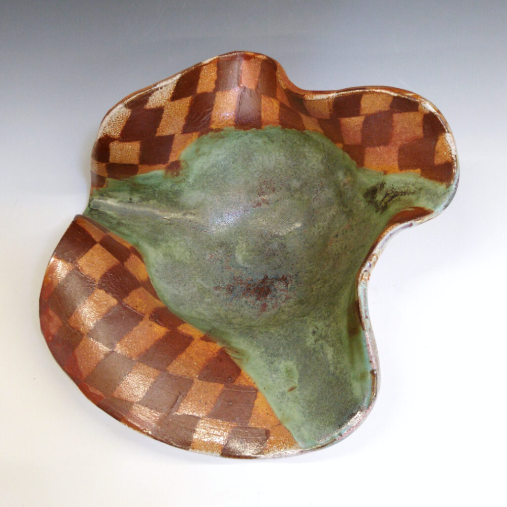 Cantaloupe Bowl 01 is a soda-fired ceramic fruit bowl with a bright green glaze over a warm brown nerikomi checker pattern.