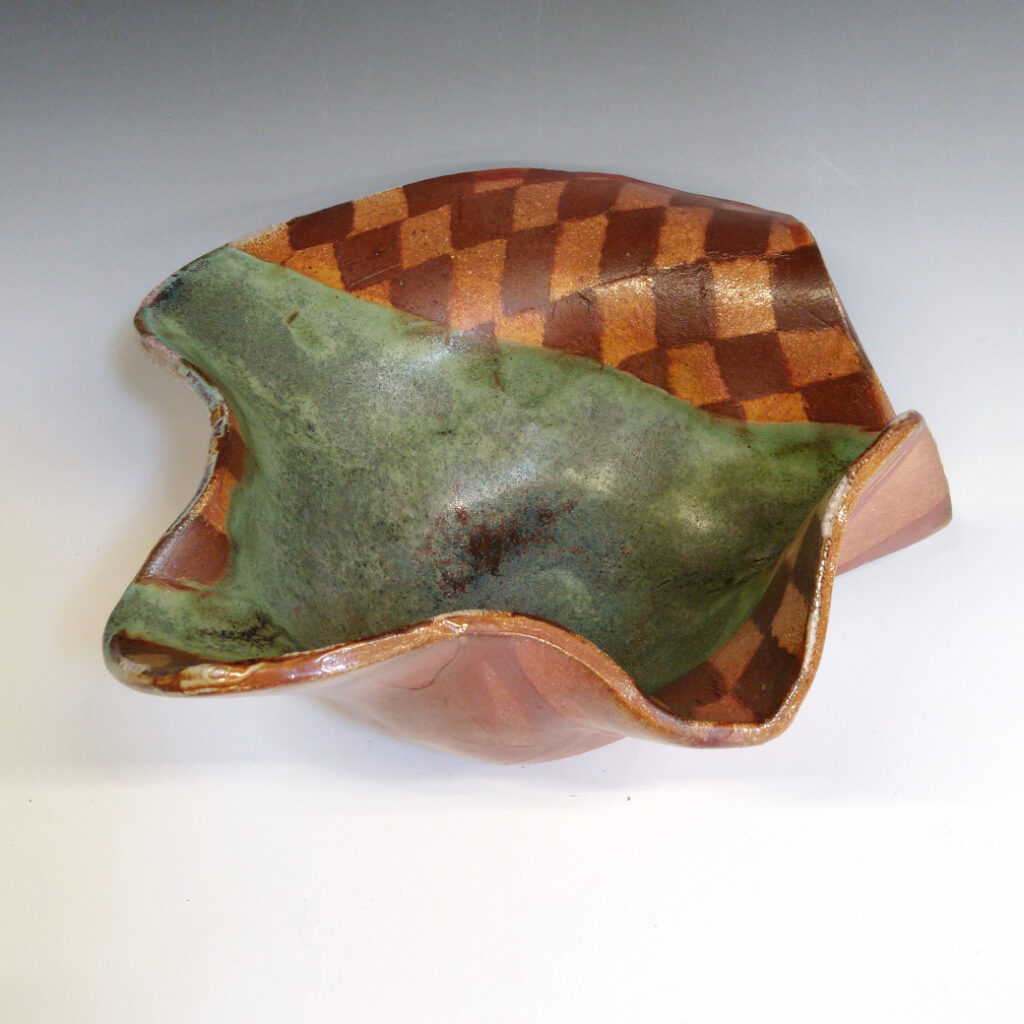 Cantaloupe Bowl 01 is a soda-fired ceramic fruit bowl with a bright green glaze over a warm brown nerikomi checker pattern.