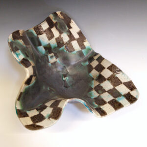 Cantaloupe Bowl 02 is a soda-fired ceramic fruit bowl with a blue-black glaze over a dark brown nerikomi checker pattern.