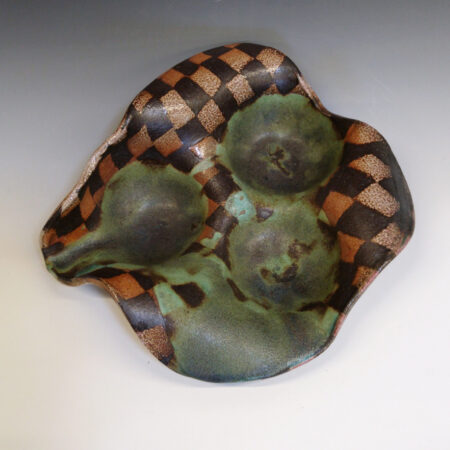 Orange Bowl 02 is a soda-fired ceramic fruit bowl with a bright green glaze over a dark brown nerikomi checker pattern.