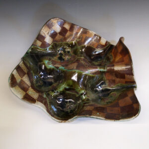 Orange Bowl 03 is a soda-fired ceramic fruit bowl with a dark green glaze over a warm brown nerikomi checker pattern.